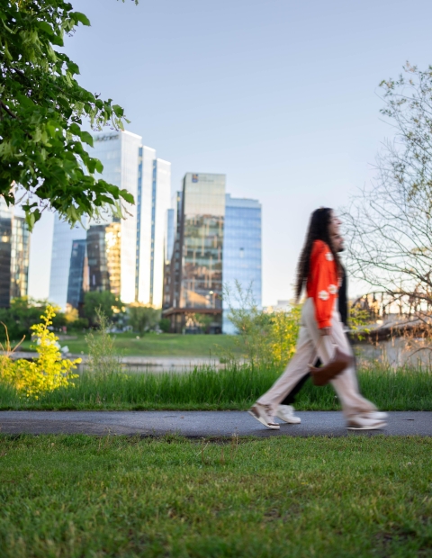 Couple Walking with River Landing in Background