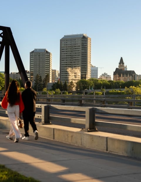 Couple Walking Across Victoria Bridge