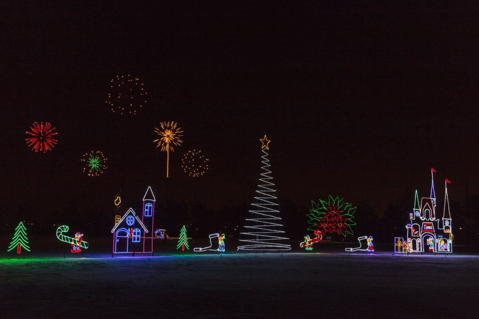 Christmas trees and houses dressed up in holiday lights