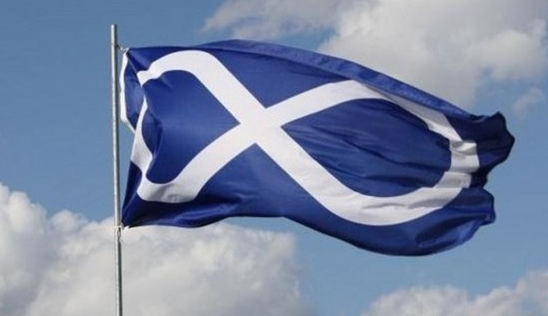 Blue Metis flag with a white figure 8 is flying