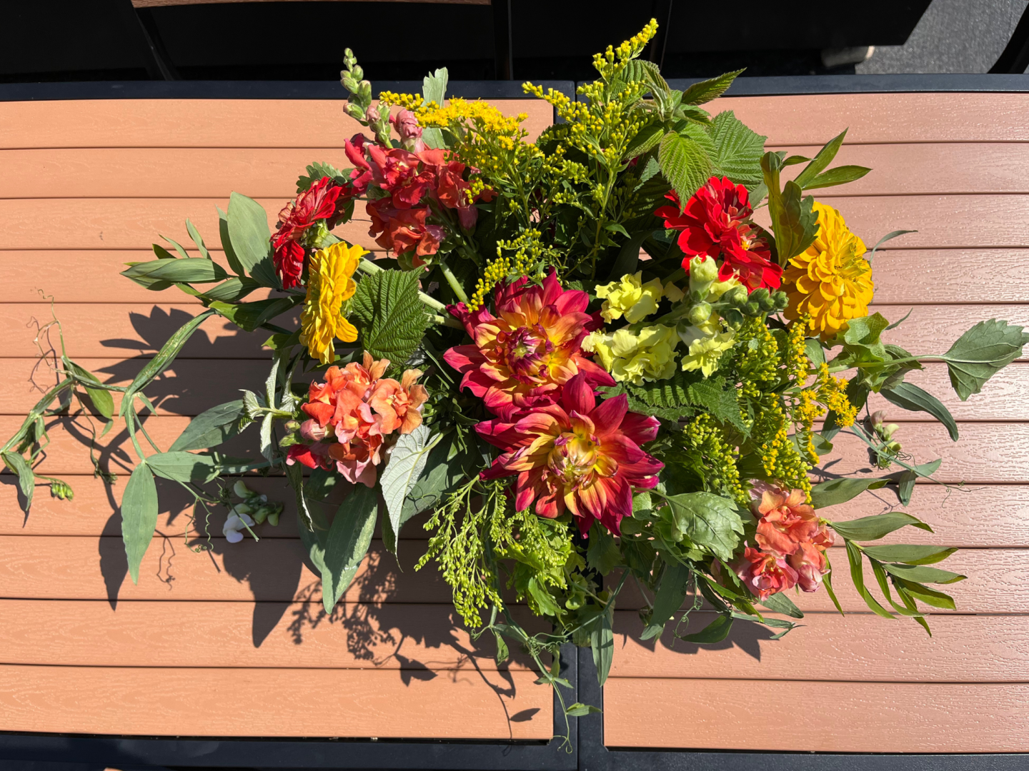 Red flower arrangement made at the Black Fox Flower Class