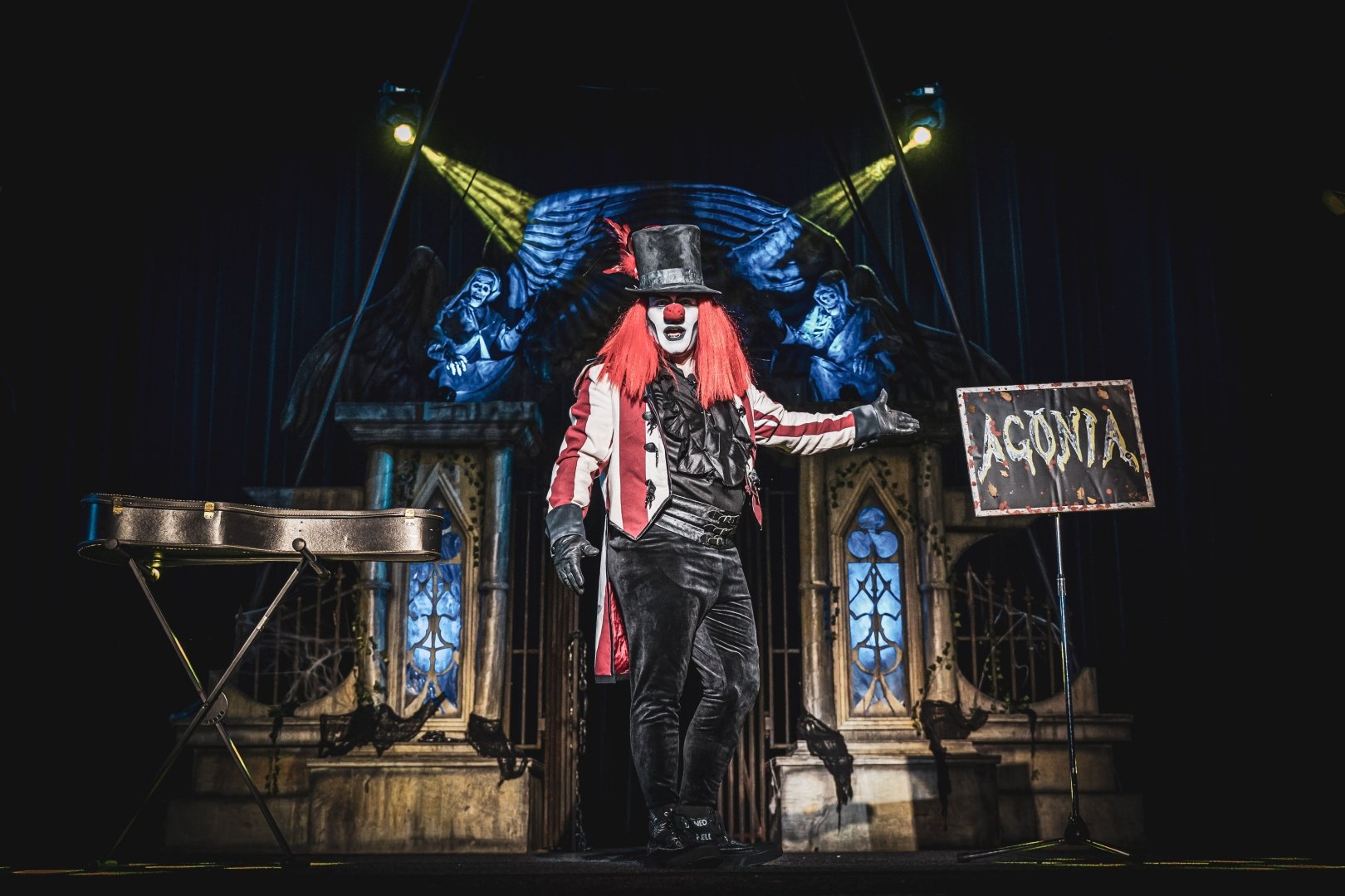 Photo of an actor dressed as a vampire clown on stage