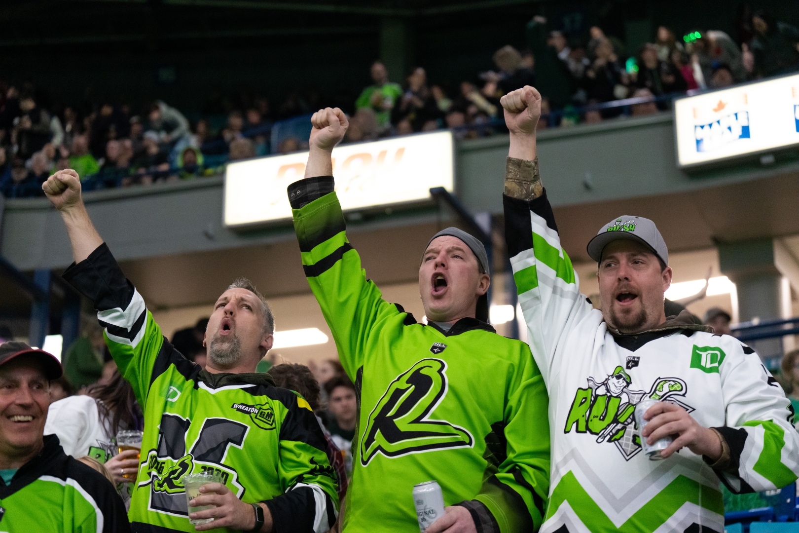 Three Rush Fans Cheering in the Stands