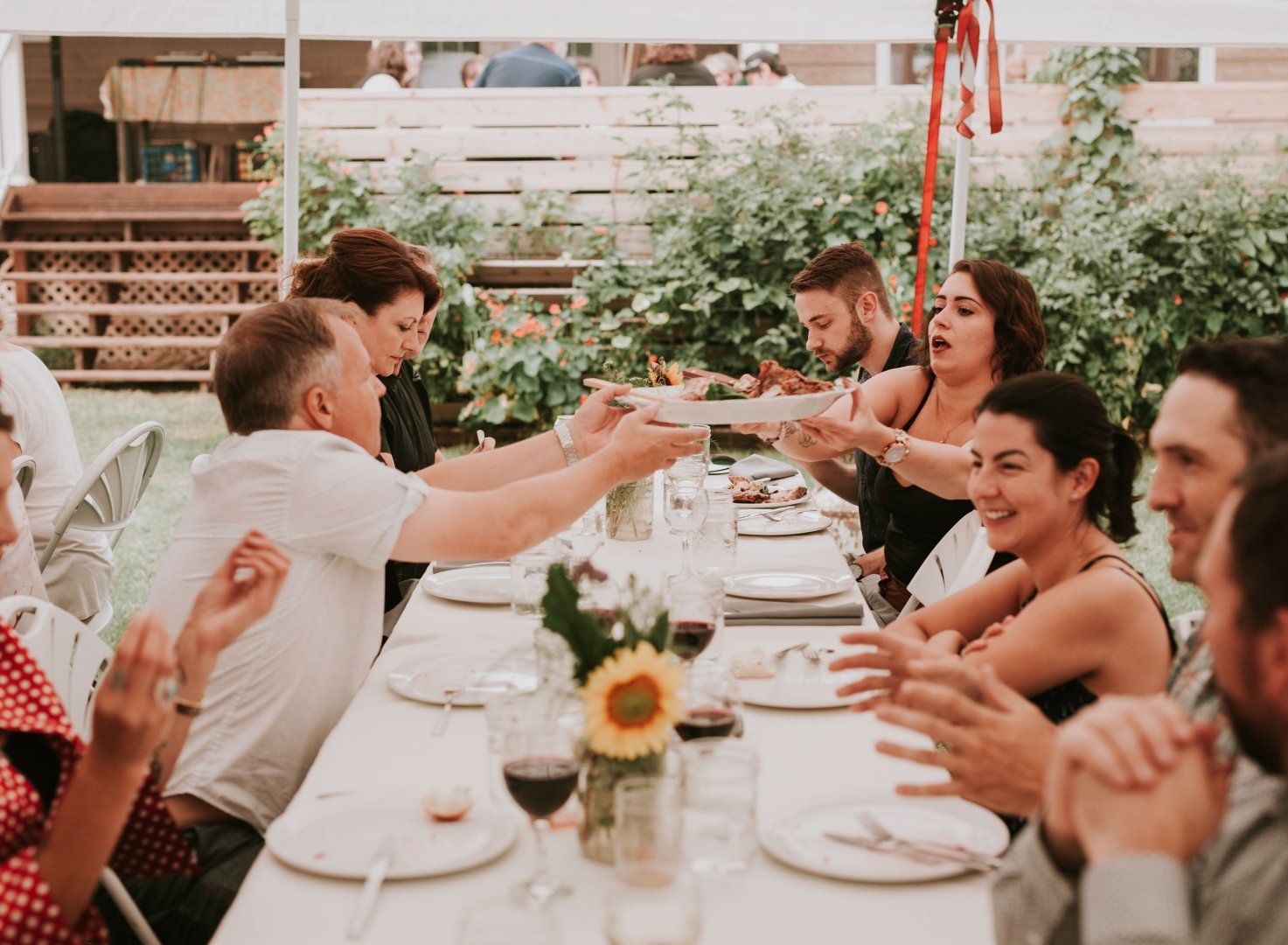 People share plates in a beautiful outdoor setting