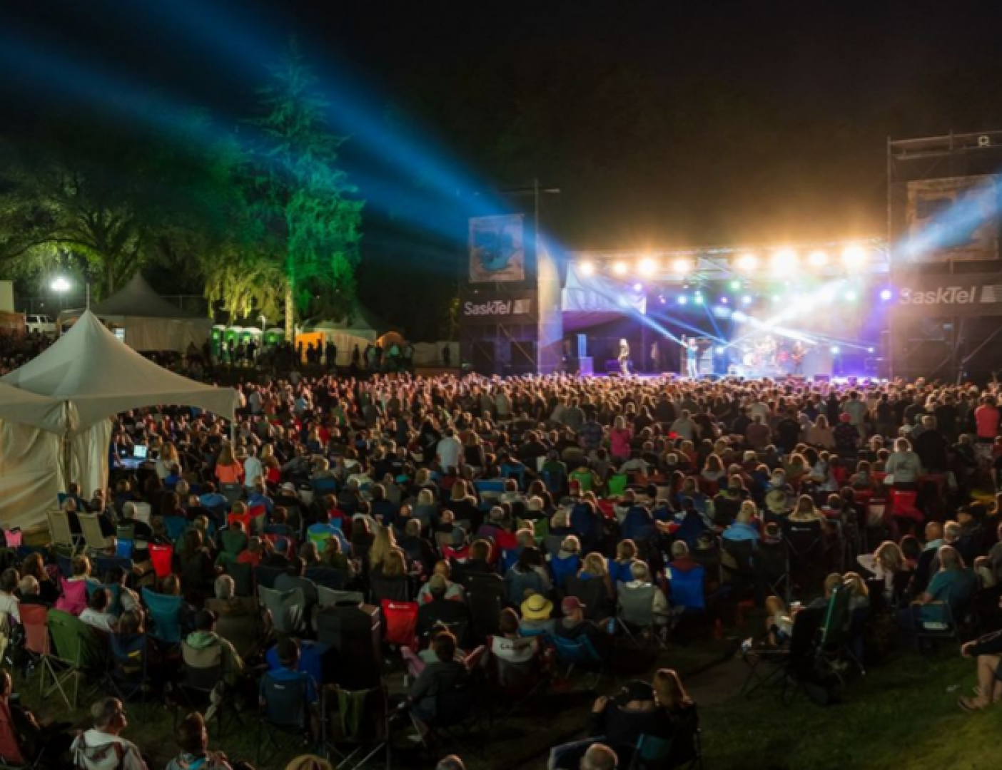 People watching a concert at night.