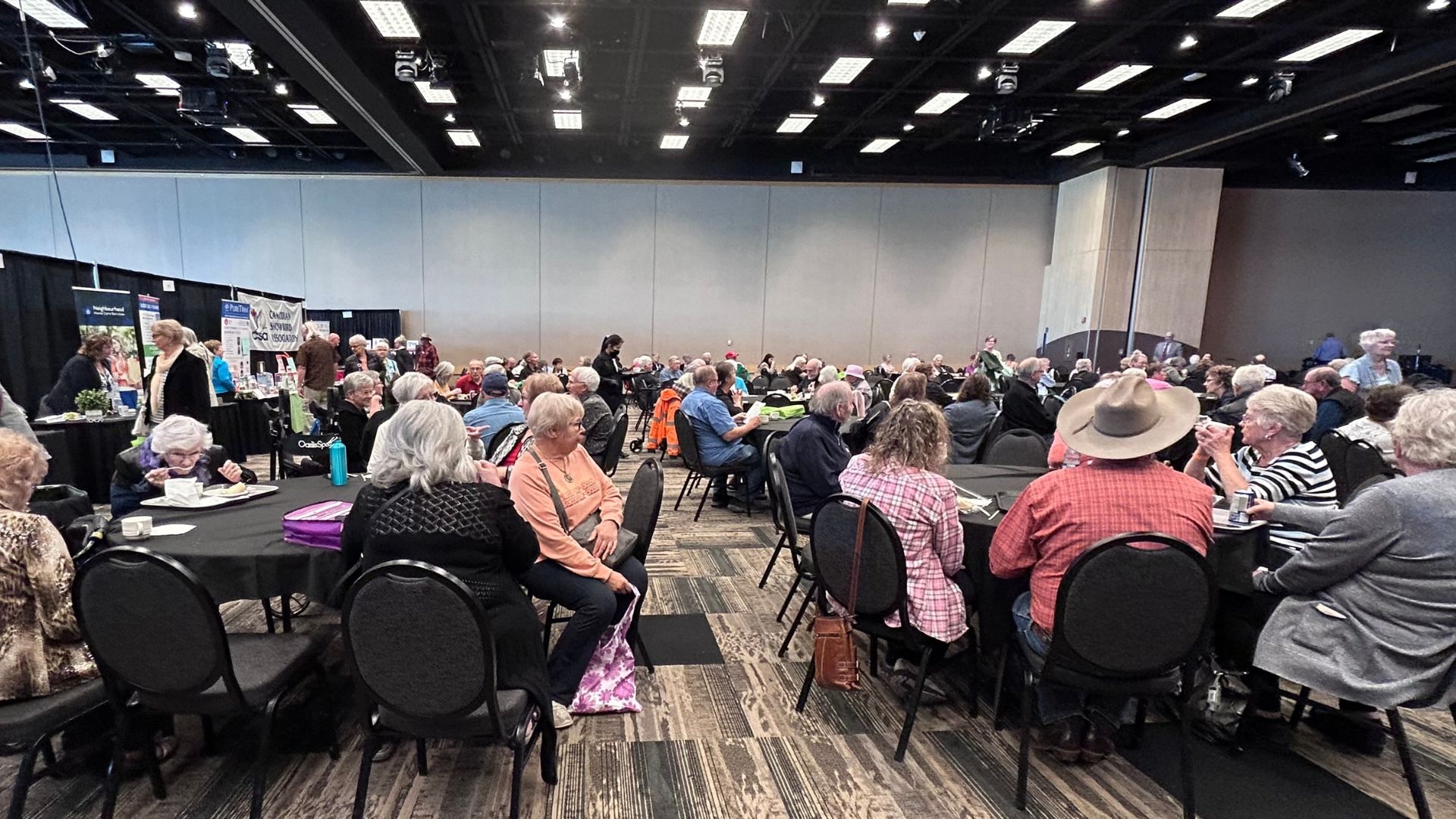 A large crowd enjoying the entertainment at Spotlight on Seniors 2024