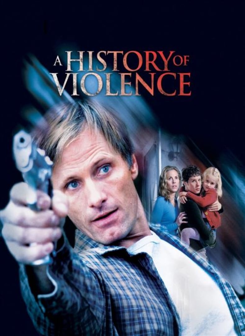 Image from the movie; A History of Violence. Shows the main actor holding a gun on one side and then a woman and a man holding a young girl looking in fear in the far out distance. 