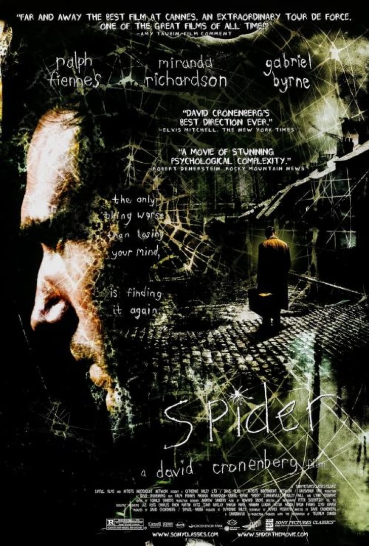 Image of the movie poster: the fly. Shows half of Ralph Fiennes (the actor) faces and then a spider web with a man standing on a cobbled street with a suitcase.
