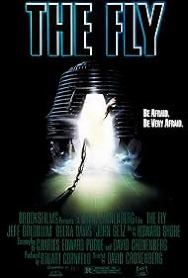 Image of the movie poster; The Fly. A pod with bright light is shown with a chain coming out of it. 