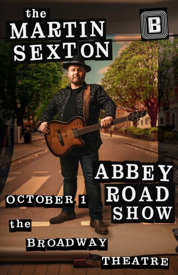 Image of Martin Sexton wearing all black and a brown guitar standing in the middle of a crosswalk with trees lining the street behind him. Text is written: The Martin Sexton Abbey Road Show October 1 The Broadway Theatre