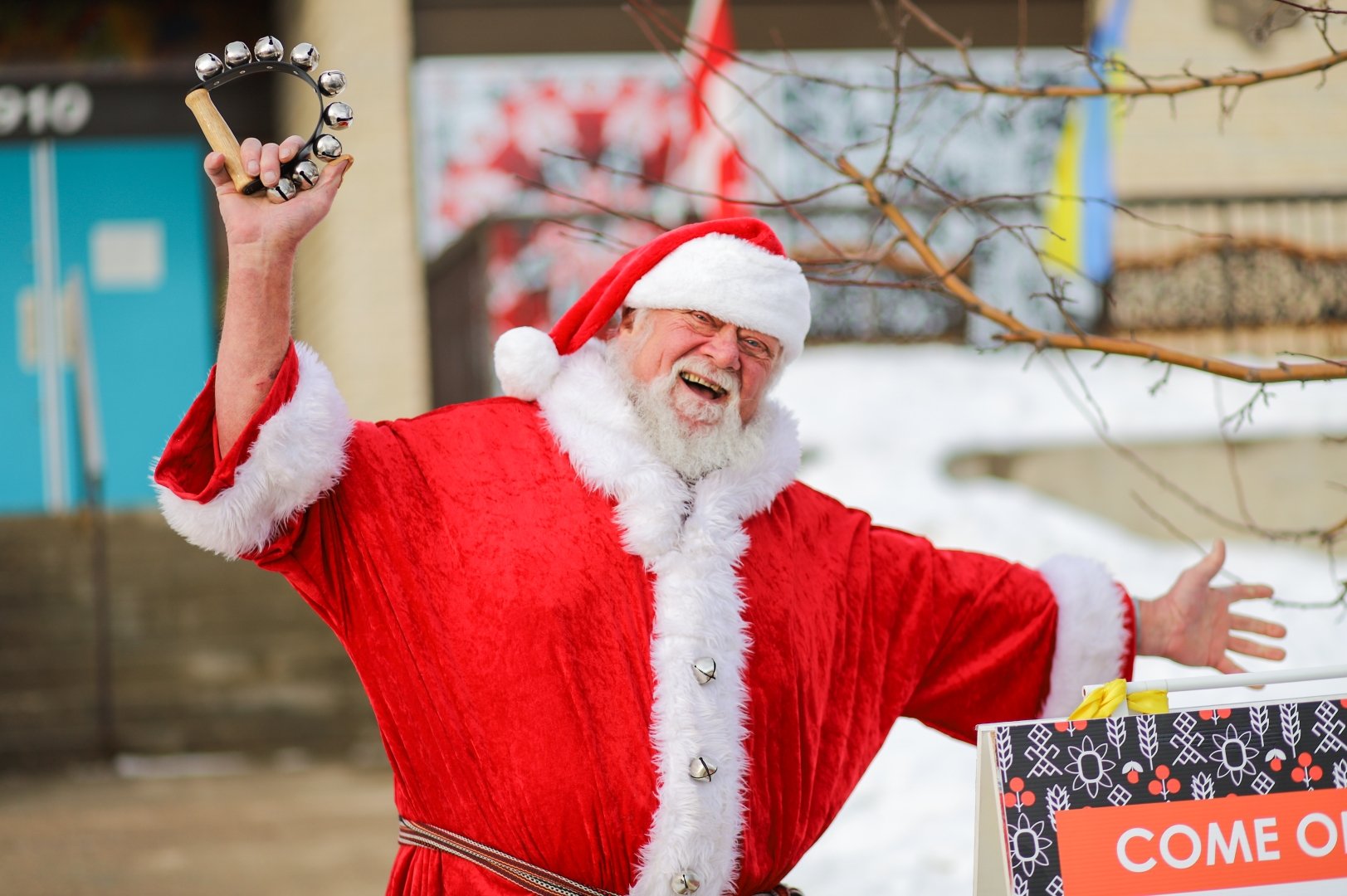 Photo of Santa greeting everyone outside of  the Ukrainian Museum of Canada main entrance