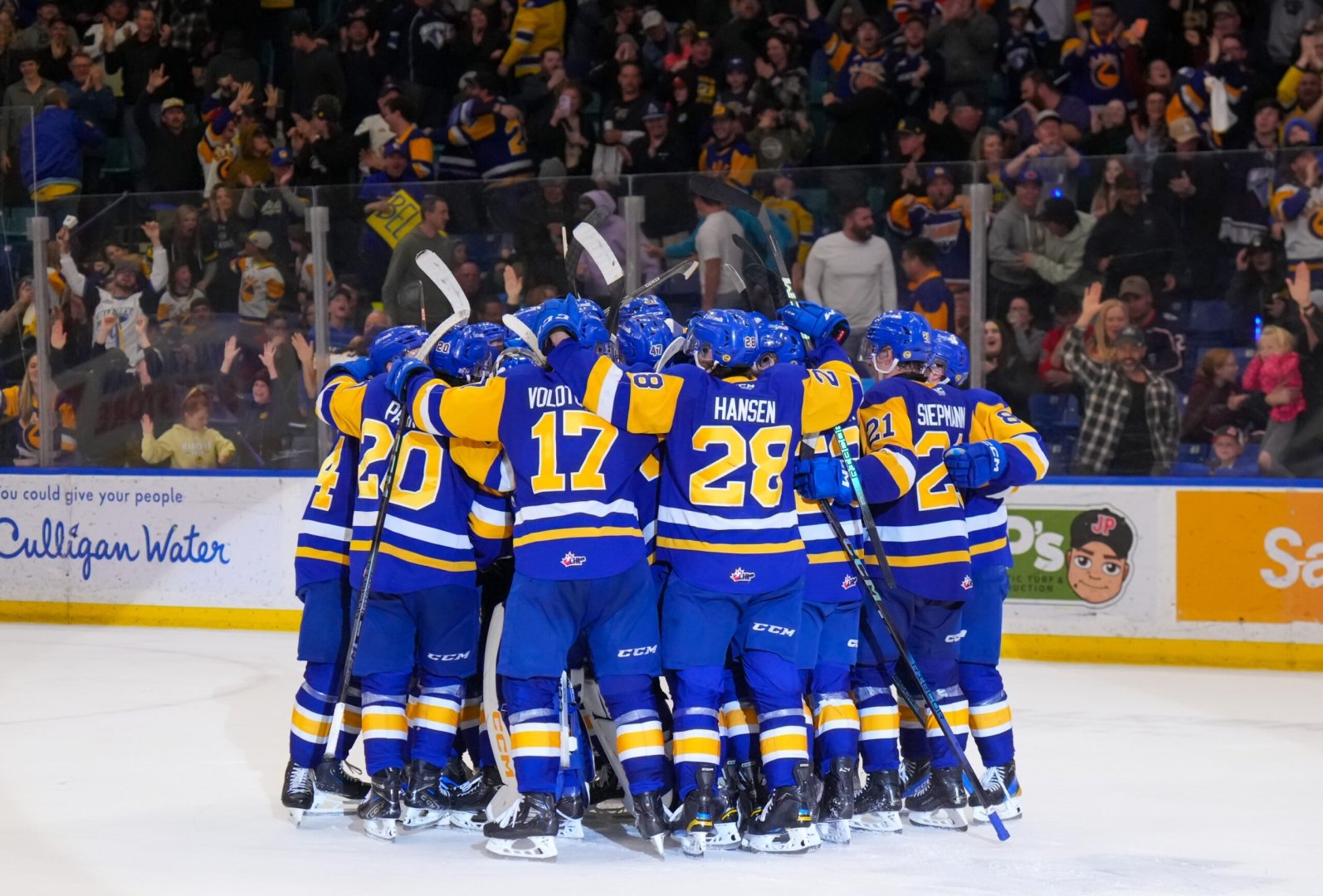 Blades players gathered together after a goal at Sasktel Centre