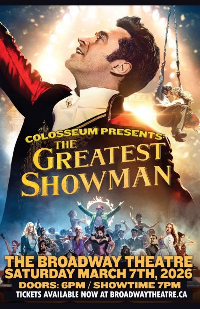 Image of actor Hugh Jackman from the movie "The Greatest Showman" looking off in the distance. The rest of the actors are all posing in smaller scales. 