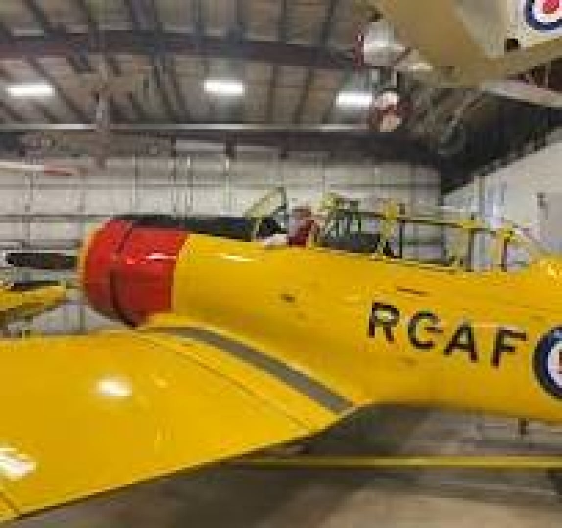 Picture of a person sitting inside the Harvard Aircraft