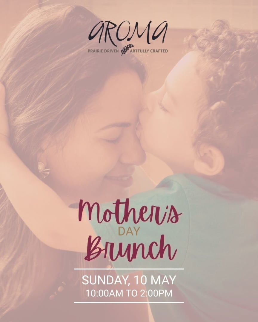 A male child kissing his mother on the forehead. With text overlapping that says Aroma Mother's Day Brunch Sunday, 10 May. 10am to 2pm