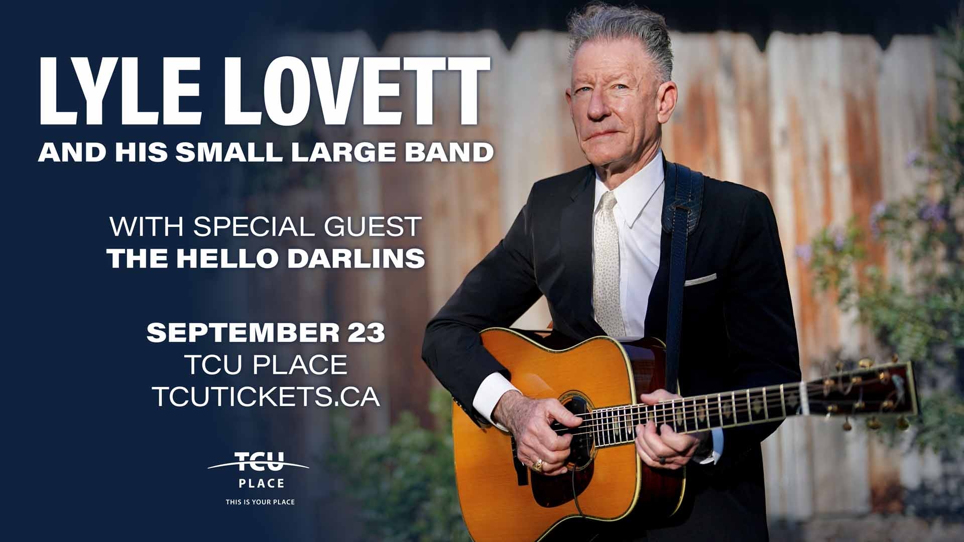 An image of Lyle Lovett holding a guitar.