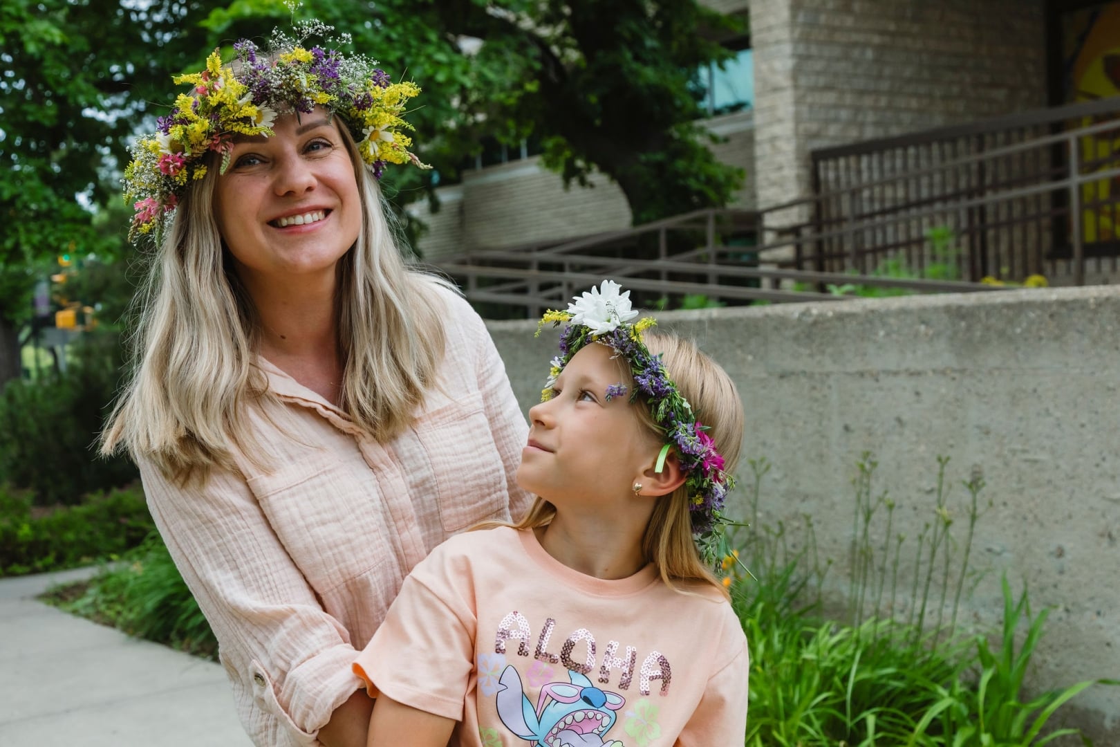 Photo of Kupala participants from summer 2025 wearing handmade vinky (floral wreaths) made out of wildflowers