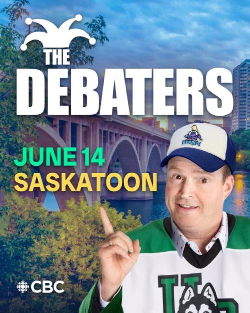 Image of Steve Patterson, wearing a huskies jersey and a Saskatoon berries hat, posing in front of the broadway bridge.