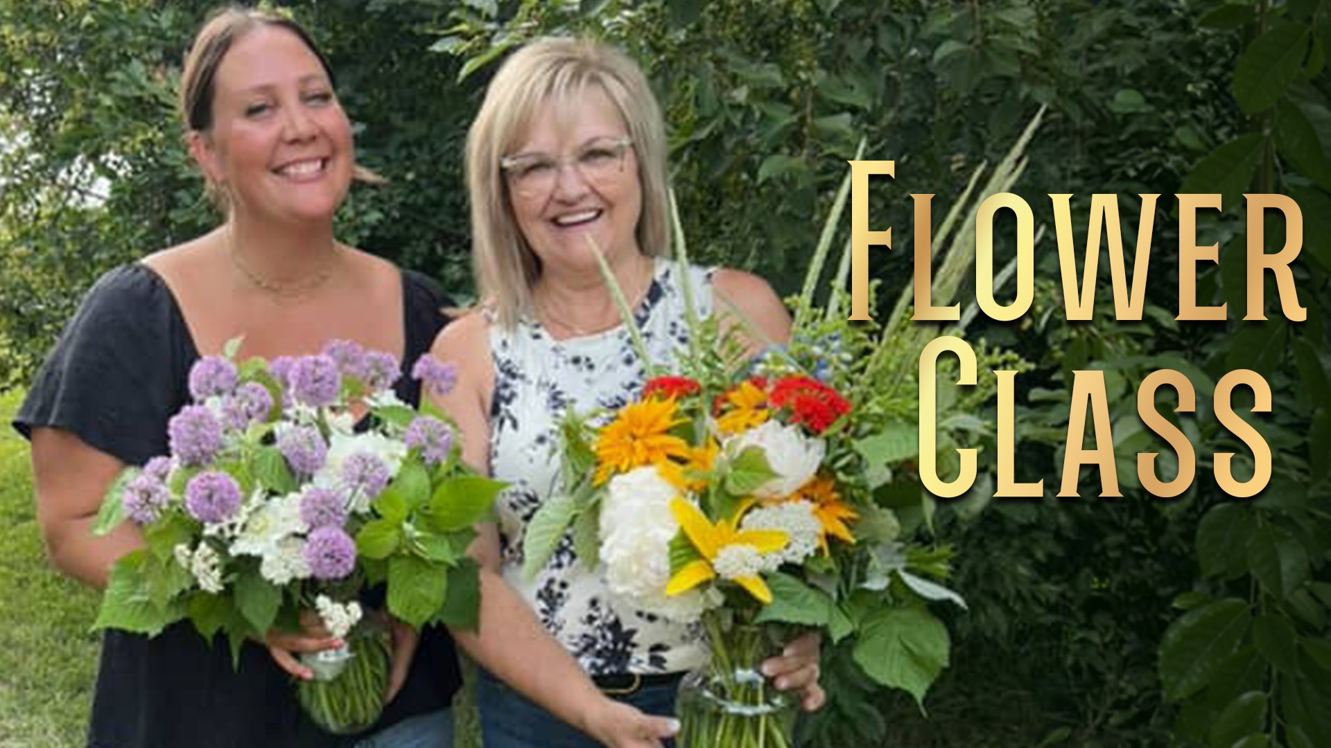Two women stand outside at Black Fox Farm and Distillery holding flower arrangements after attending a flower class.