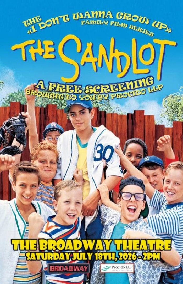 Image of the child actors from the Sandlot, holding up one of the kids and cheering and holding up 