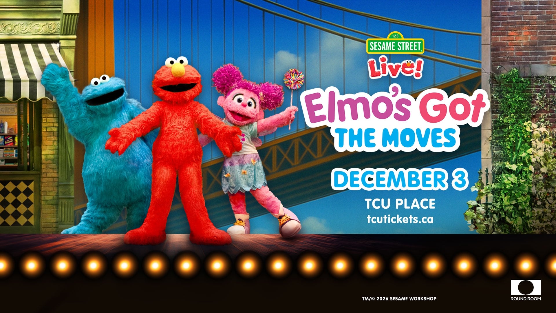 An image of Elmo, Cookie Monster, and Zoey from Sesame Street on a stage.