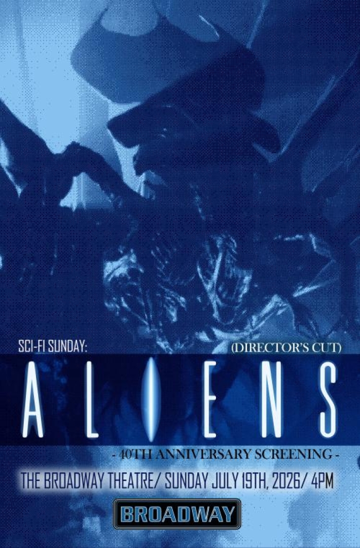 Image from the move Aliens, with the alien in blue monochrome lighting.