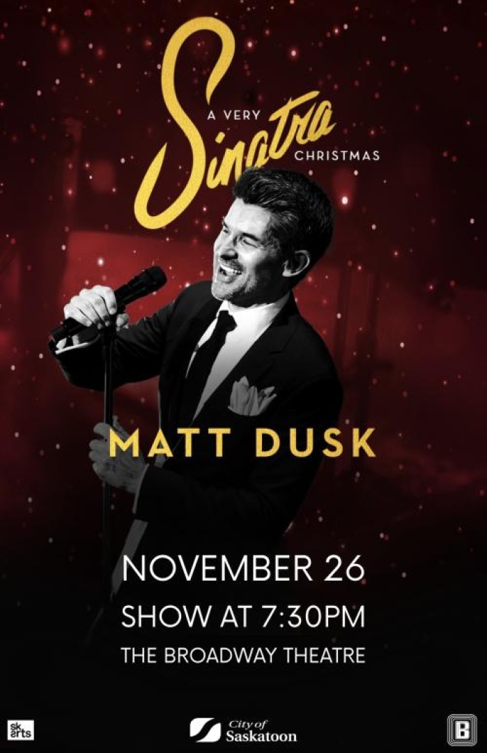 Image of Matt Dusk in a black and white photo, smiling in front of a mic.