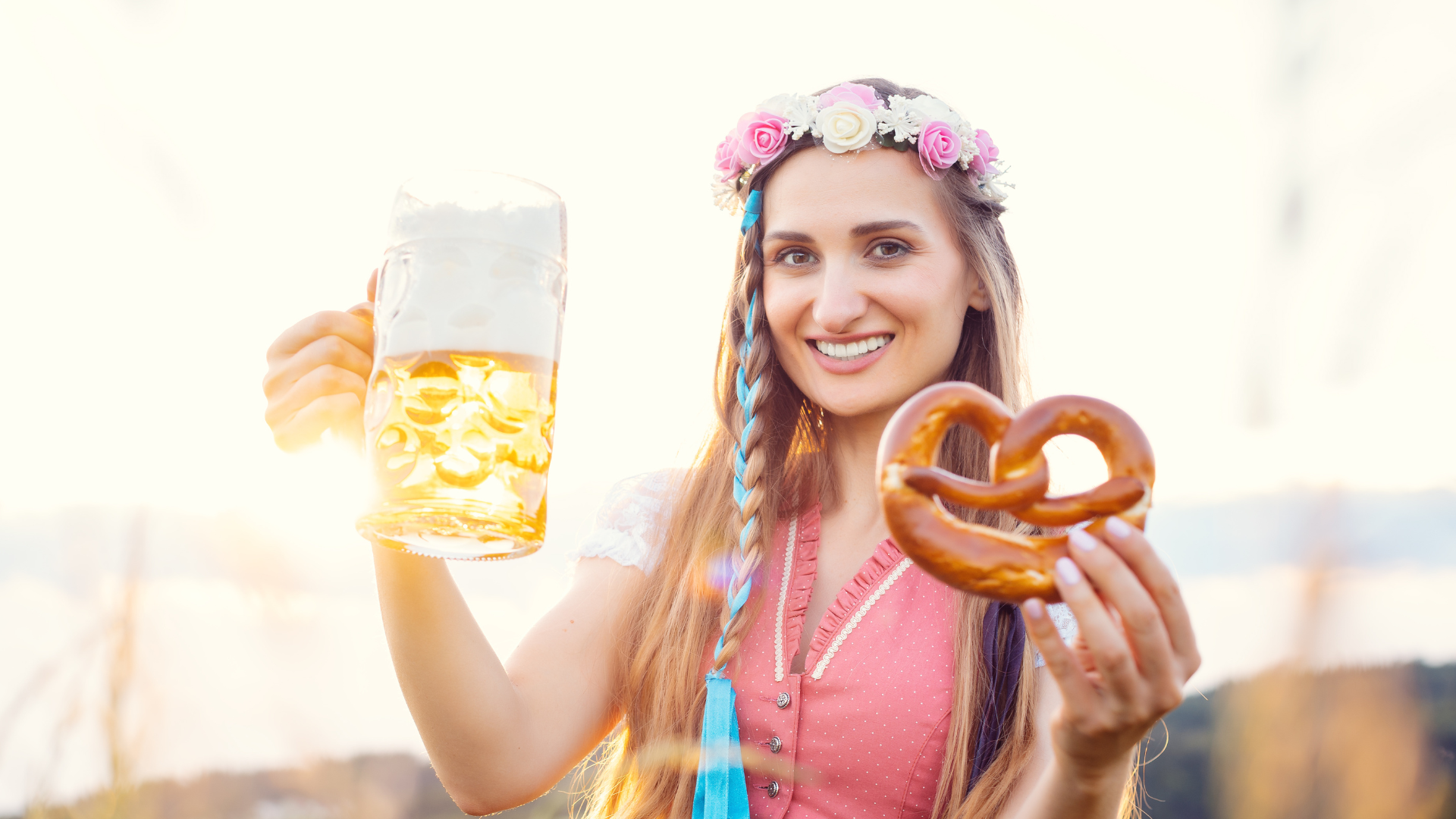 Bavarian Girl hold Pretzel and beer in hands