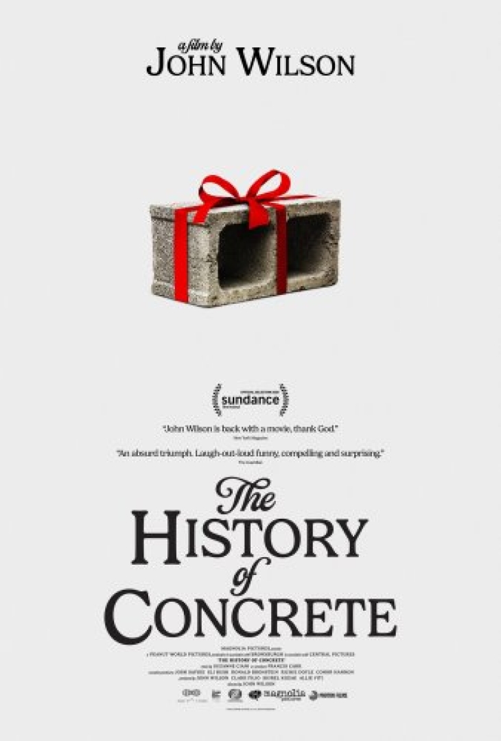 Image of a concrete block with a red ribbon tied around it, like a present.