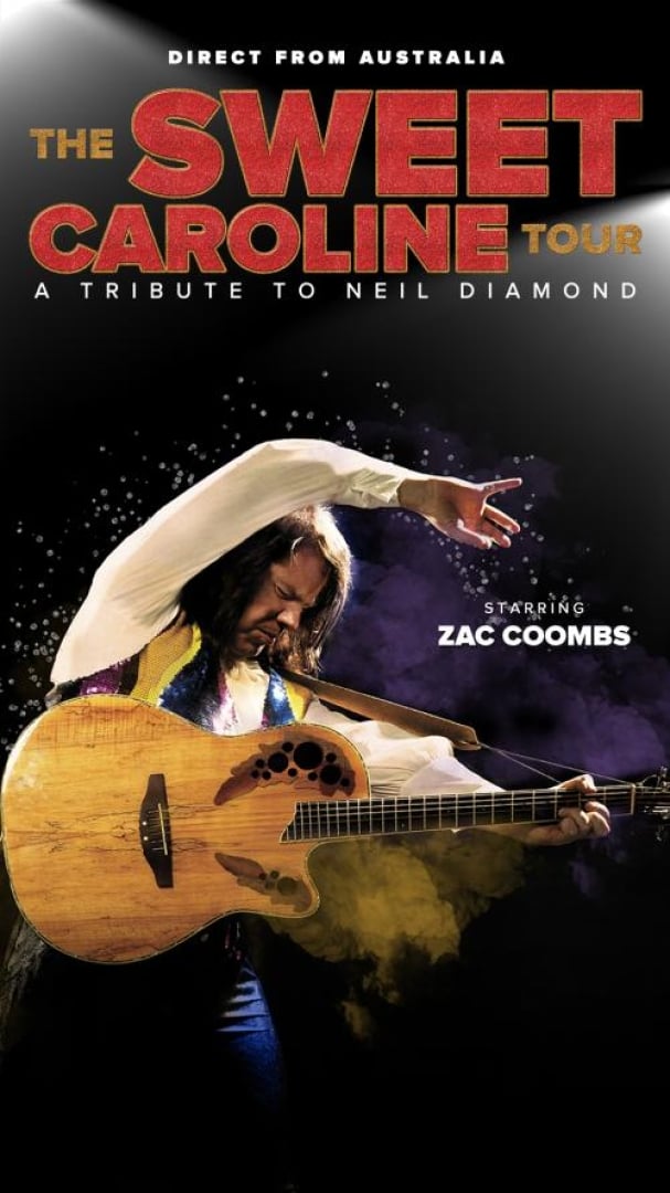 Image of tribute impersonator Zac Combs as Neil Diamond, posing with a guitar and smoke behind him.