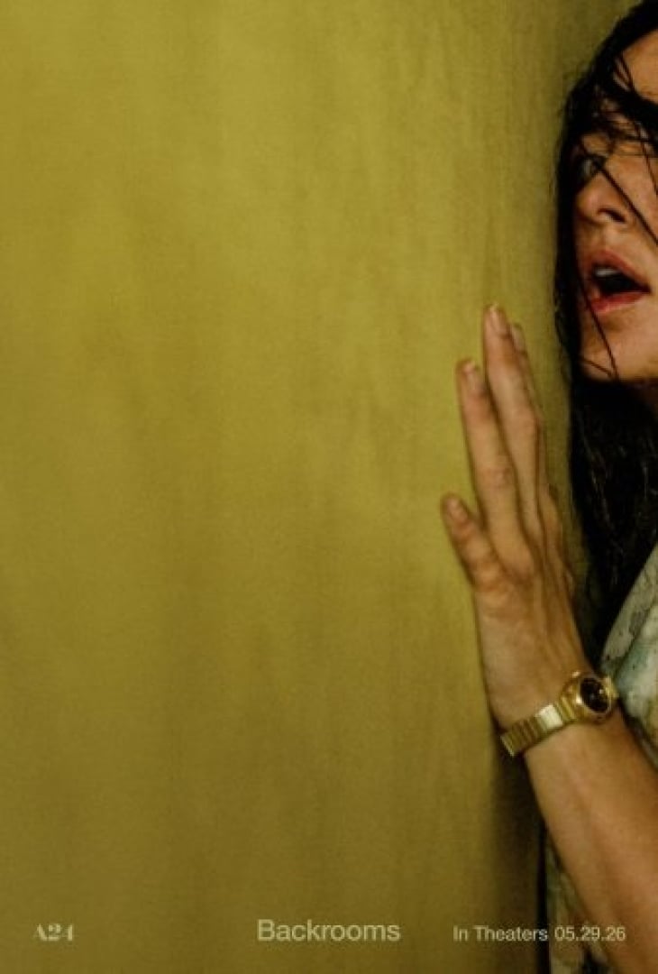 Image of a blank yellow wall, with a woman pressed up against it, looking distraught, and only half of her face and body shown.